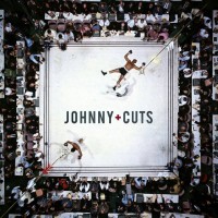 Johnny + Cuts Barbershop Logo