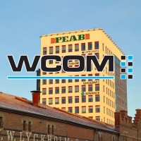 WCOM AB Logo
