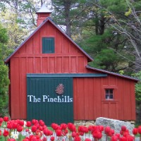 Pinehills LLC Logo