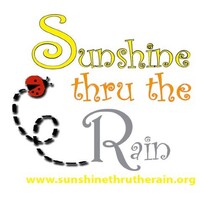 SUNSHINE THRU THE RAIN Logo