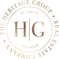 The Heritage Group Real Estate Co Logo