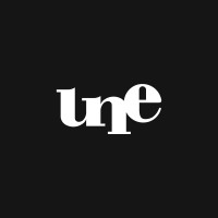 UNE - Imóveis em rede Logo