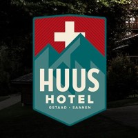 Huus Gstaad Hotel Logo