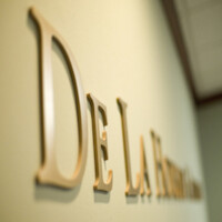 De La Housaye & Associates - A Law Corporation Logo