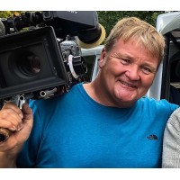 Mike Caine - Lighting Cameraman. DoP. OB Cameraman. Self Directing Cameraman. Logo
