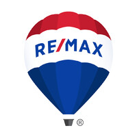 RE/MAX Champions Realty Inc Logo