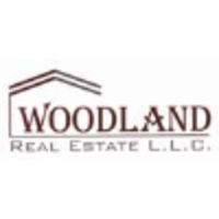 Woodland Real Estate Broker L.L.C Logo