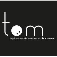 TOM.travel Logo