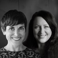Aryne + Dulcinea with Living Room Realty Logo