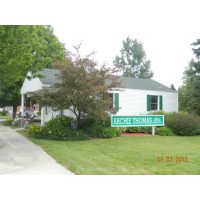 Archie Thomas Real Estate Logo