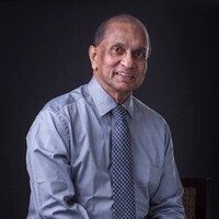 Ronnie Peiris inc Logo