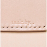 nude.by... Logo