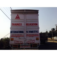 Shainex Packers and Movers Car Relocation Services Logo